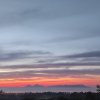 Vista di un tramonto con isole in lontananza.